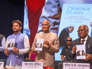 A book titled "Ambedkar and Modi" released by former President Ram Nath Kovind_4.1