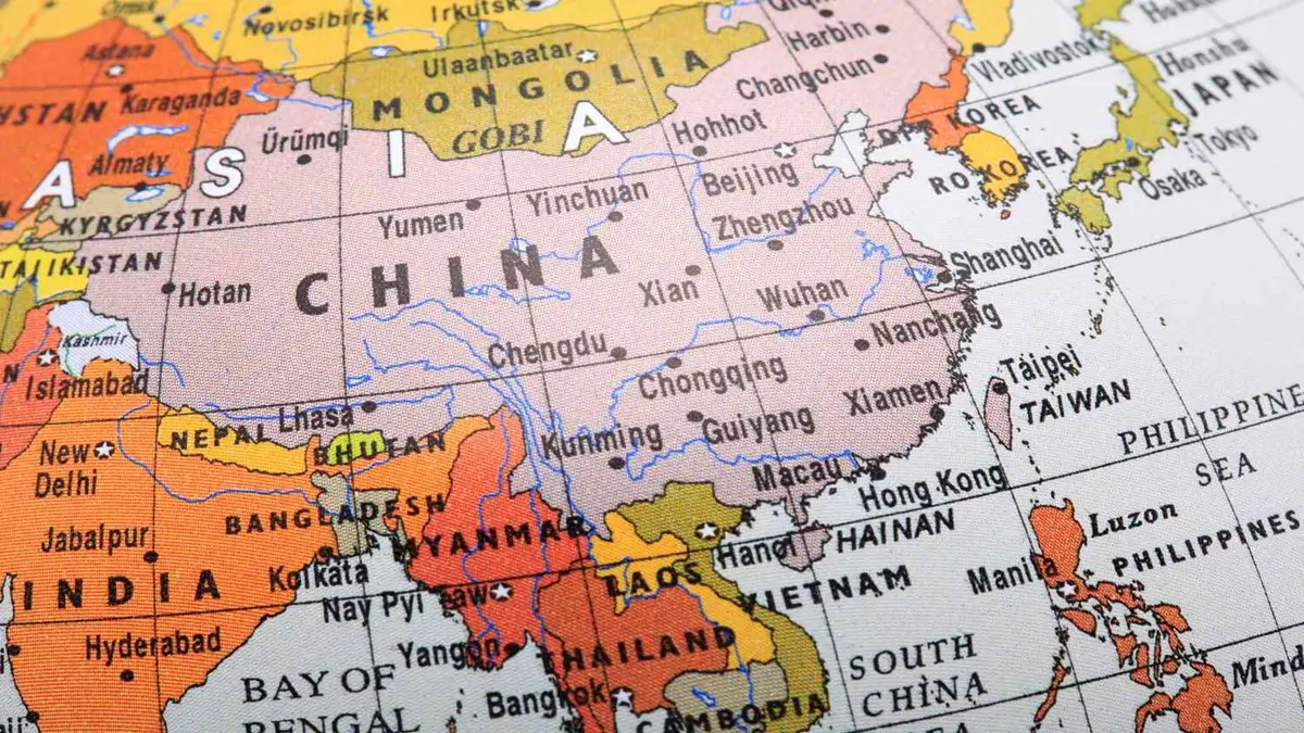 Which Country Shares Borders with the Most Countries in the World?